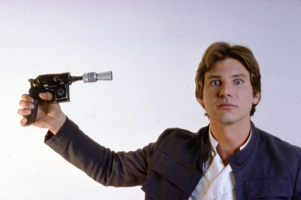 Han Solo (Harrison Ford) pointing a blaster at his head - Star Wars Empire Strikes Back Behind the Scenes